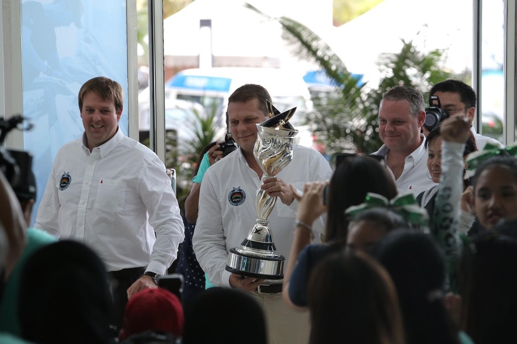 L-R Craig Mitchell, Tour Director, James Pleasance, Executive Director arrive with the AWMRT Trophy ©  Miyeera Navaretna